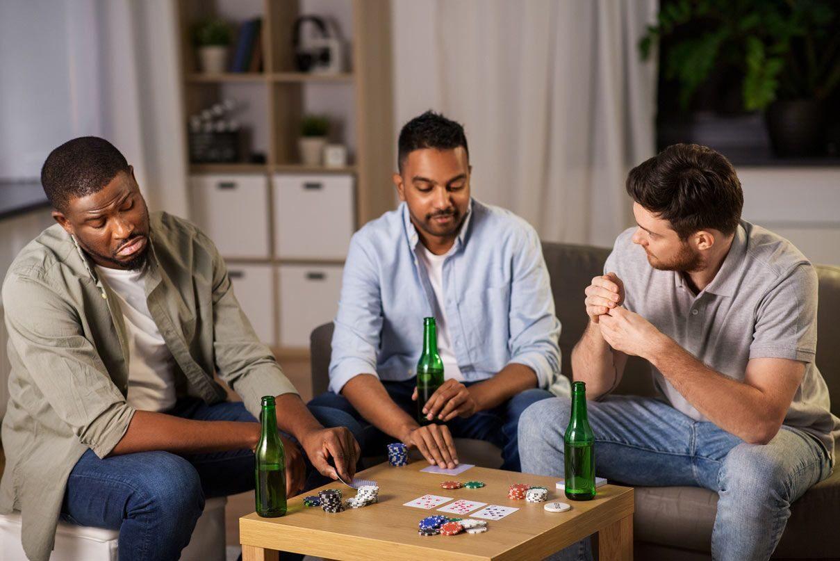 Friends enjoying a relaxed home poker night around the table