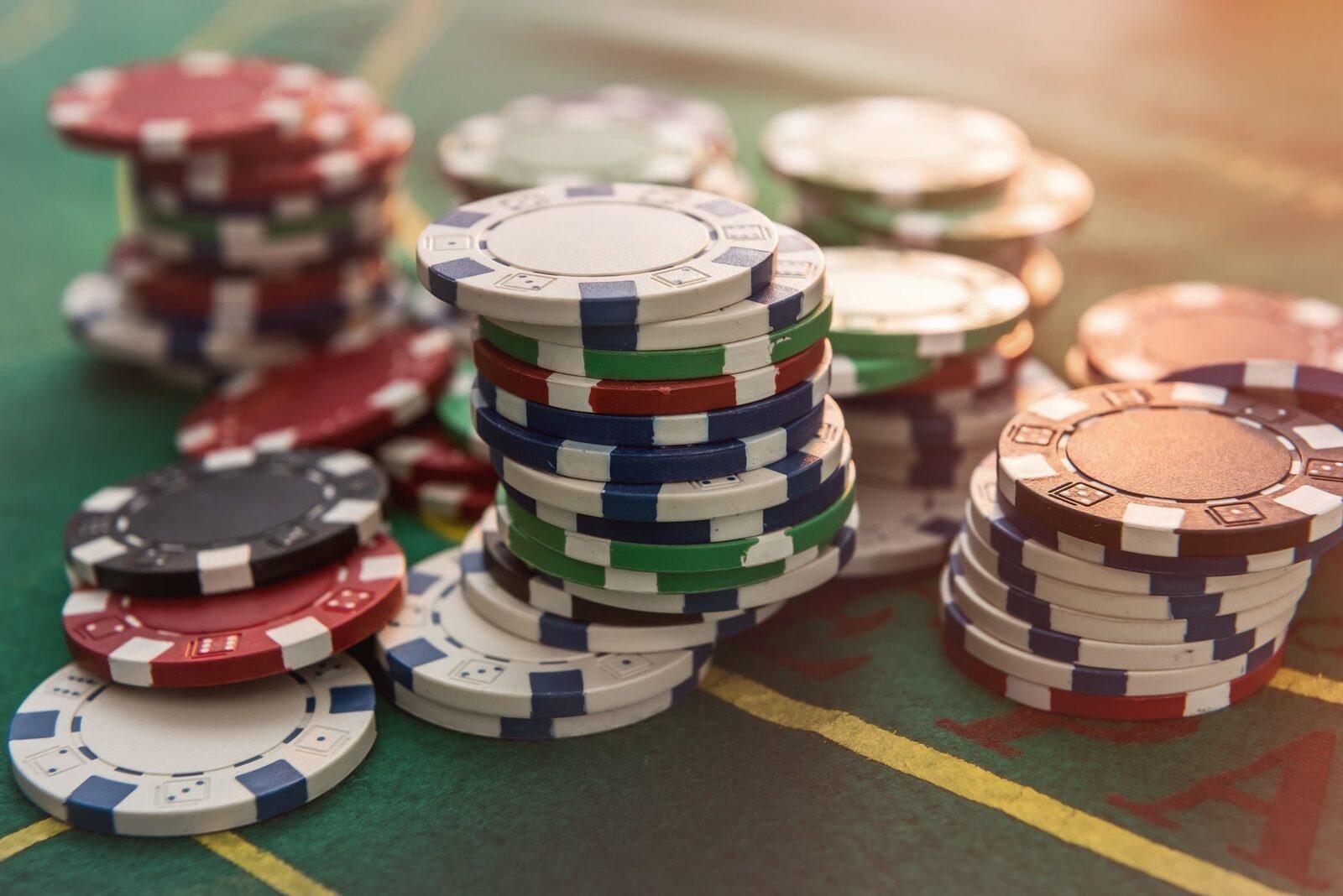Close-up of colourful poker chip stacks showing different chip values